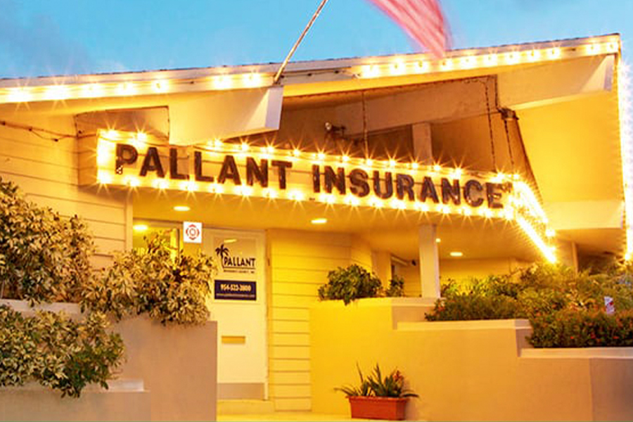 Fort Lauderdale, FL - Closeup View of Pallant / NSi Insurance Group Office Building at Night with String Lights and American Flag